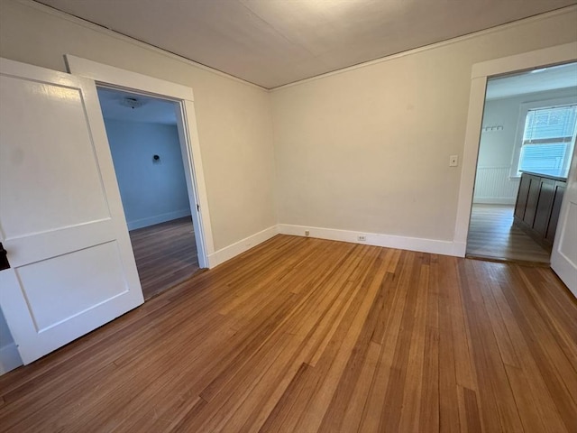 spare room with hardwood / wood-style floors