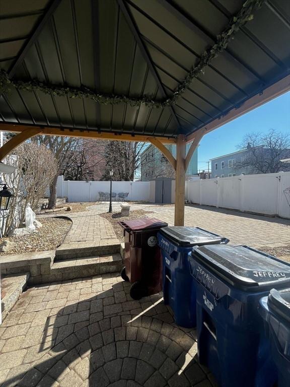 view of patio with a gazebo and a fenced backyard