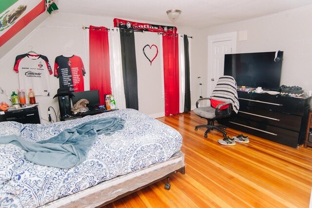 bedroom with wood finished floors