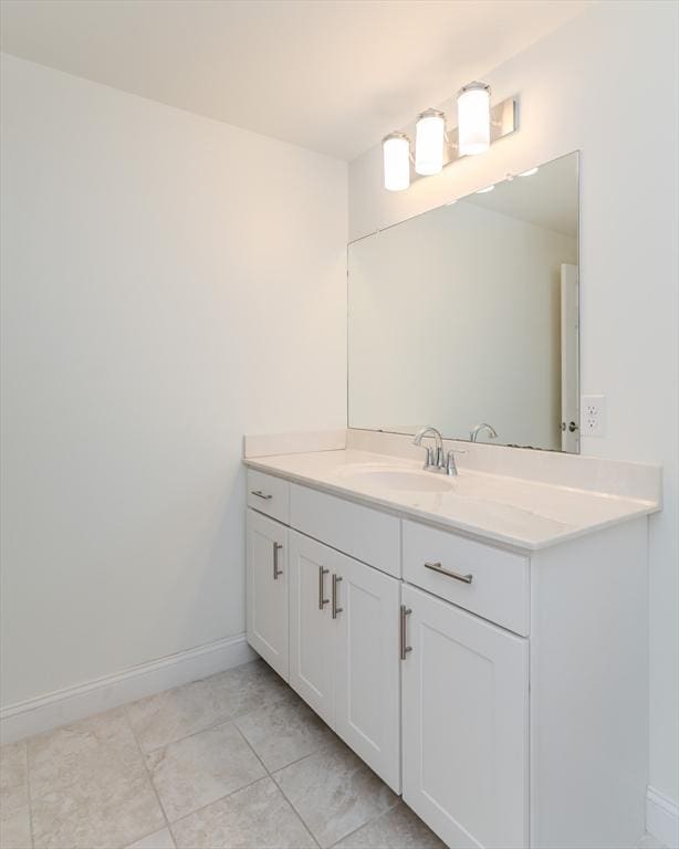 bathroom with tile patterned floors and vanity