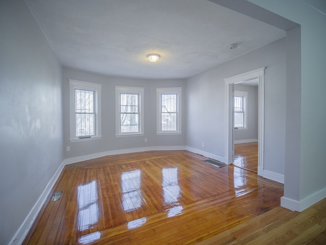 empty room featuring hardwood / wood-style flooring