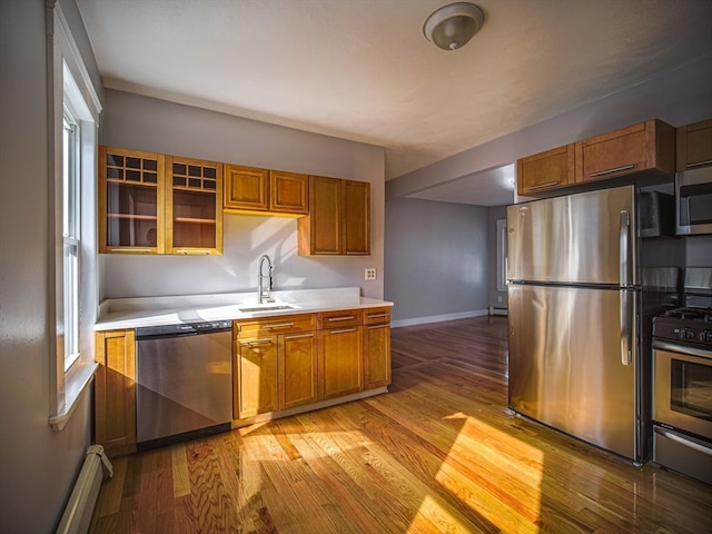 kitchen featuring sink, stainless steel appliances, and light hardwood / wood-style floors