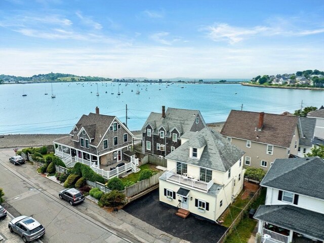 birds eye view of property with a residential view and a water view