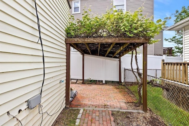 view of patio featuring fence