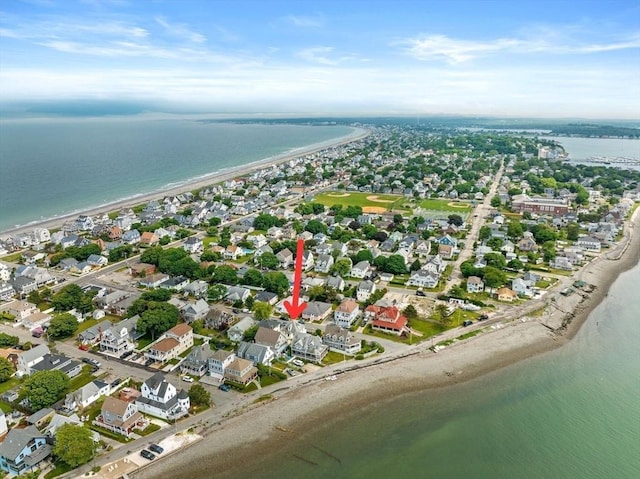 bird's eye view with a water view, a residential view, and a beach view