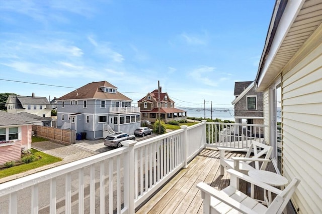 wooden terrace with a residential view