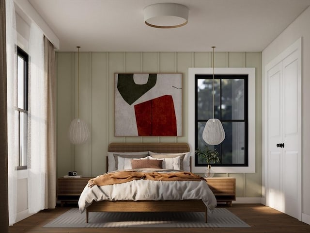 bedroom featuring dark hardwood / wood-style flooring and a closet