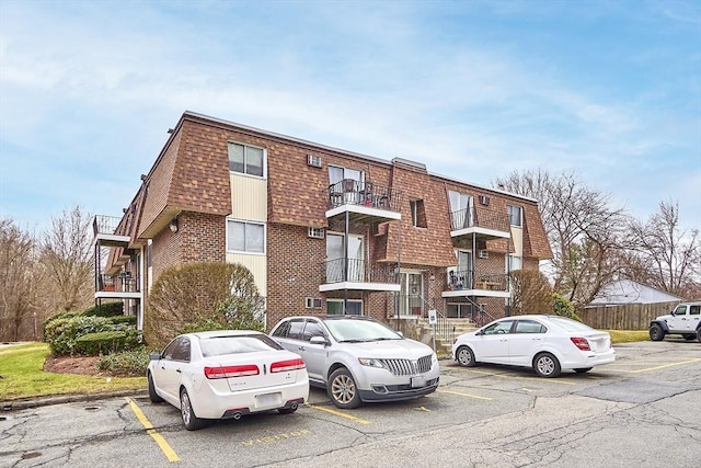 view of property featuring uncovered parking