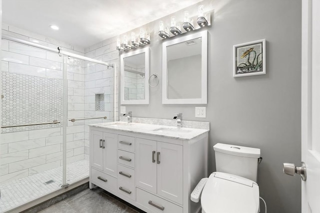 bathroom featuring vanity, toilet, and walk in shower