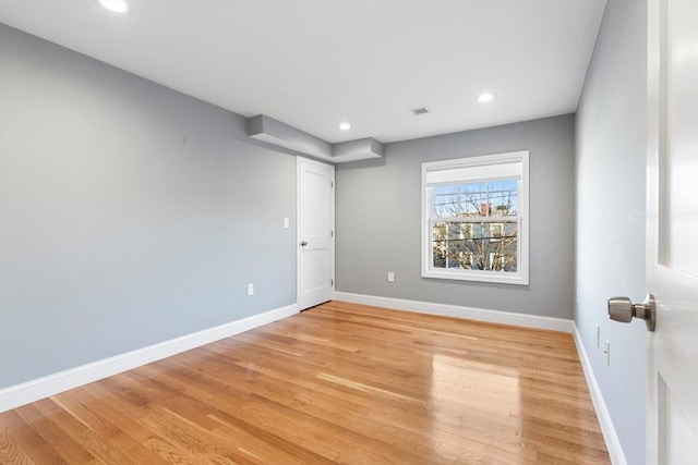 spare room with light wood-type flooring