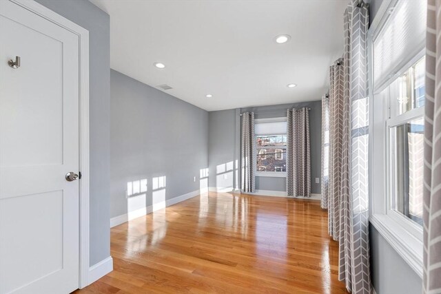 spare room featuring hardwood / wood-style floors