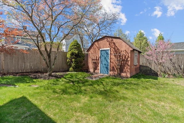 view of shed with a fenced backyard