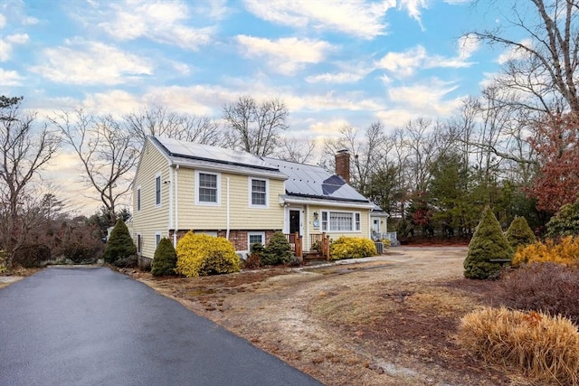 view of front of home featuring solar panels