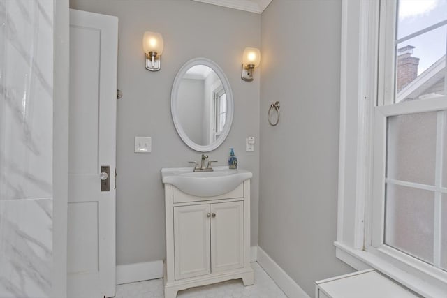 bathroom featuring vanity and baseboards