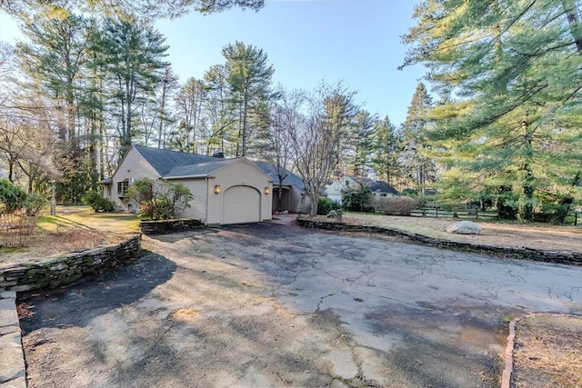 view of side of property with a garage