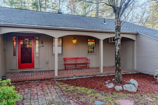 doorway to property with covered porch