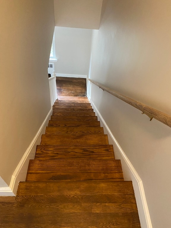 staircase featuring hardwood / wood-style floors