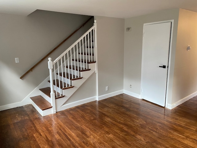 stairs with hardwood / wood-style floors