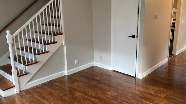 stairs featuring wood-type flooring