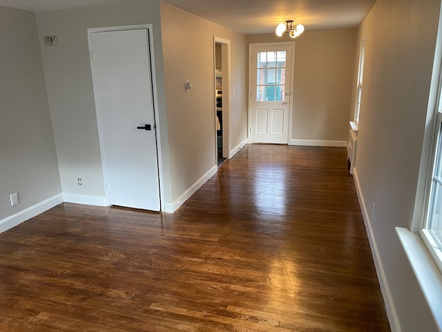 interior space with dark hardwood / wood-style flooring