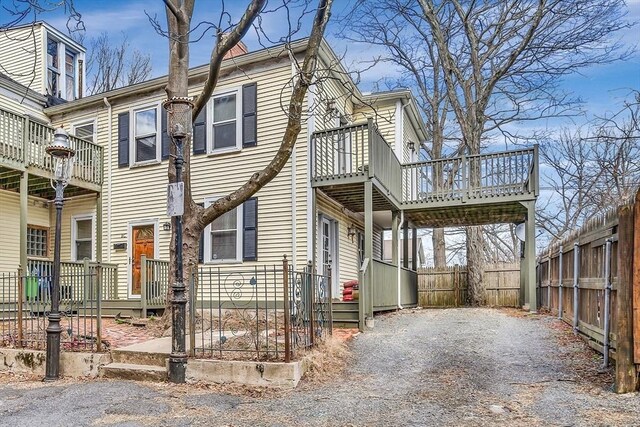 view of front of house with a balcony