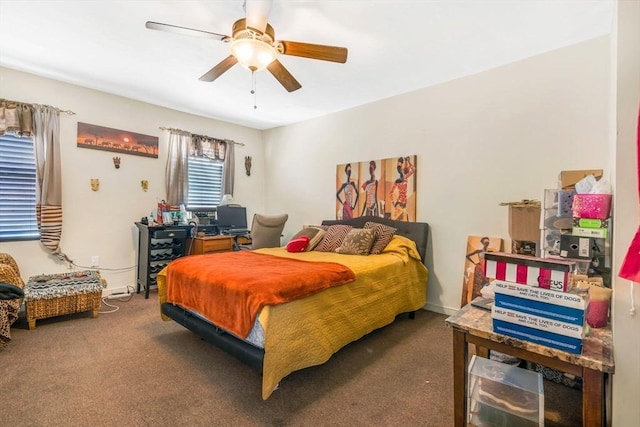 bedroom with ceiling fan and dark carpet