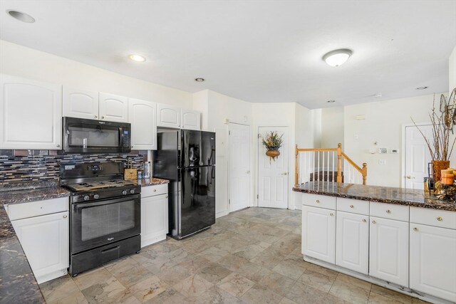 kitchen with dark stone countertops, black appliances, white cabinets, and light tile patterned flooring