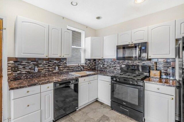 kitchen featuring white cabinetry, black appliances, decorative backsplash, sink, and light tile patterned floors