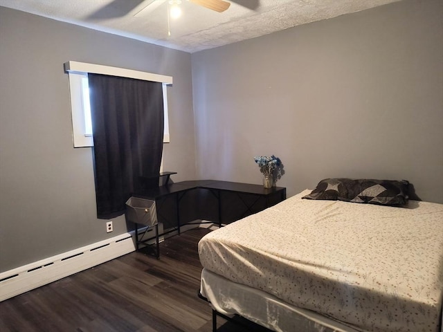 bedroom featuring dark wood-style floors, a textured ceiling, a baseboard radiator, and a ceiling fan