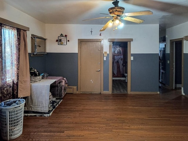 kitchen with a ceiling fan and wood finished floors