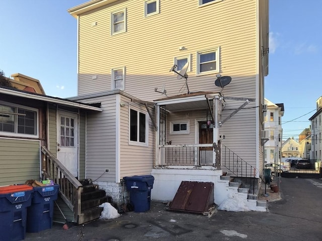 back of house featuring entry steps