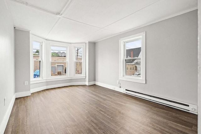 48-50 Portland St, Haverhill, MA 01830 - spare room featuring a baseboard heating unit and wood finished floors