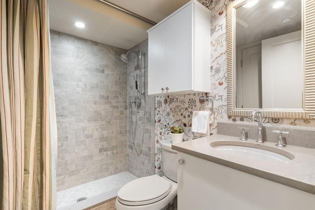 bathroom featuring a stall shower, vanity, toilet, and recessed lighting