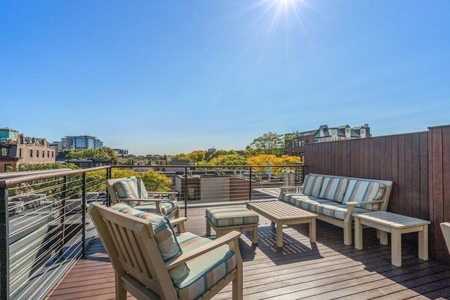 wooden terrace featuring an outdoor hangout area