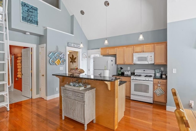 5 Lazy Day Dr Unit 5, Westford, MA 01886 - kitchen with high vaulted ceiling, a kitchen breakfast bar, light wood-type flooring, and white appliances