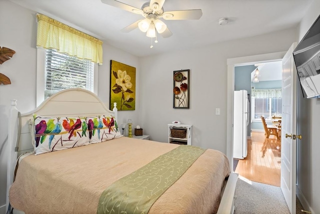 5 Lazy Day Dr Unit 5, Westford, MA 01886 - bedroom featuring freestanding refrigerator, a ceiling fan, and wood finished floors