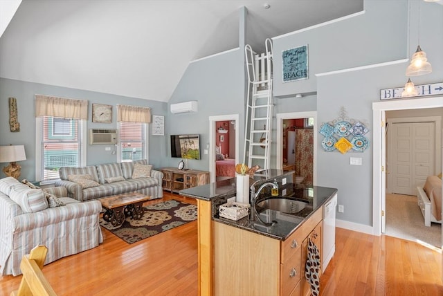 5 Lazy Day Dr Unit 5, Westford, MA 01886 - kitchen featuring open floor plan, high vaulted ceiling, light wood-type flooring, a wall unit AC, and a sink
