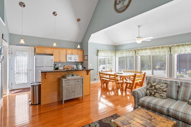 5 Lazy Day Dr Unit 5, Westford, MA 01886 - kitchen featuring dark countertops, ceiling fan, light brown cabinets, white appliances, and light wood-type flooring