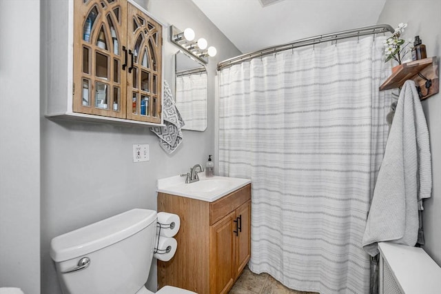 bathroom featuring vanity, tile patterned flooring, toilet, and a shower with shower curtain