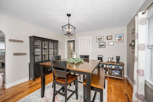 dining room featuring an inviting chandelier and light hardwood / wood-style floors