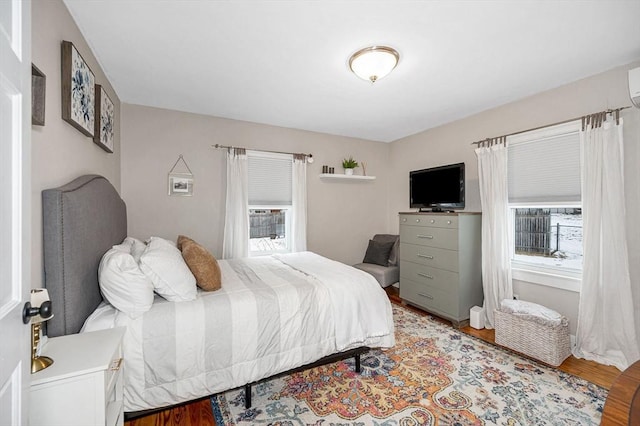 bedroom with hardwood / wood-style flooring