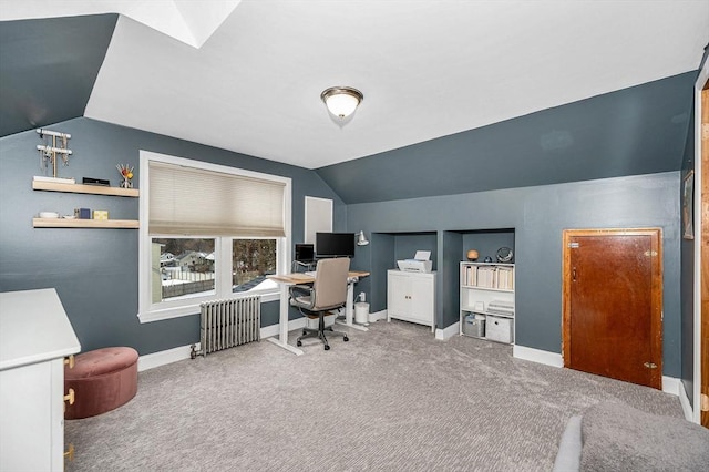 carpeted office featuring lofted ceiling and radiator heating unit