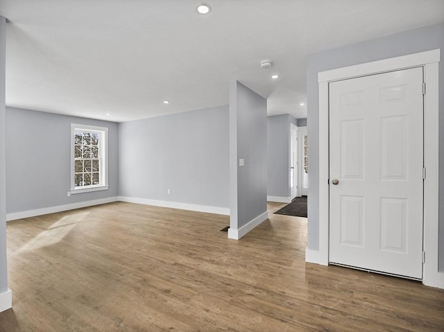 spare room featuring wood-type flooring