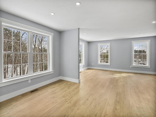 spare room with light hardwood / wood-style floors