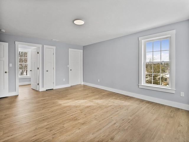 spare room featuring light wood-type flooring