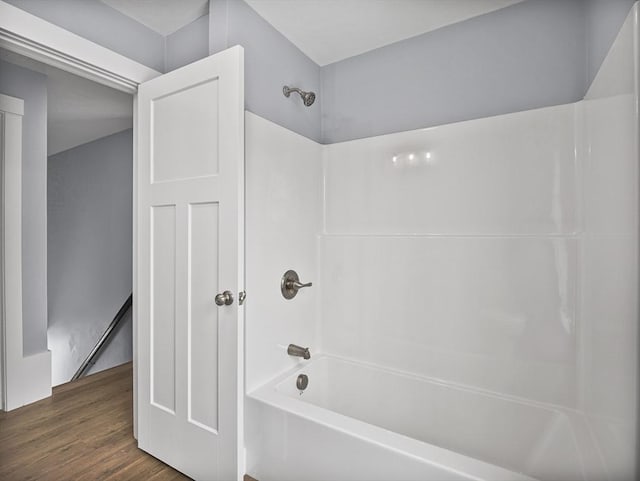 bathroom featuring wood-type flooring and shower / bathing tub combination