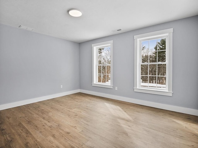 unfurnished room featuring wood-type flooring