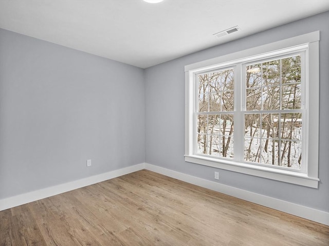 empty room featuring hardwood / wood-style floors