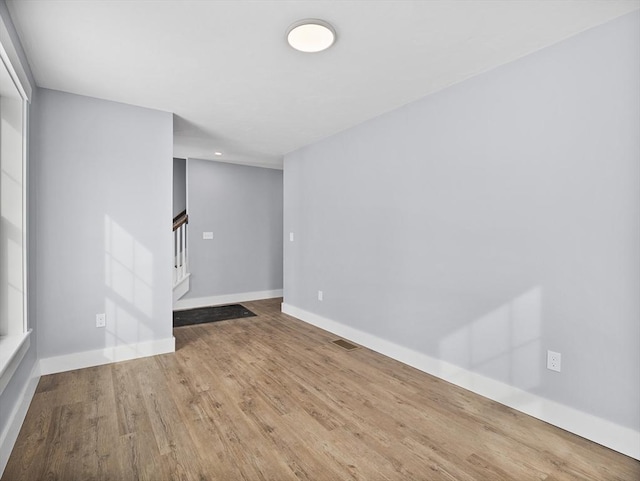 unfurnished room featuring hardwood / wood-style floors