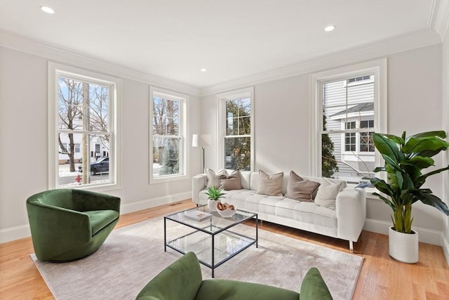 interior space featuring crown molding, baseboards, and wood finished floors